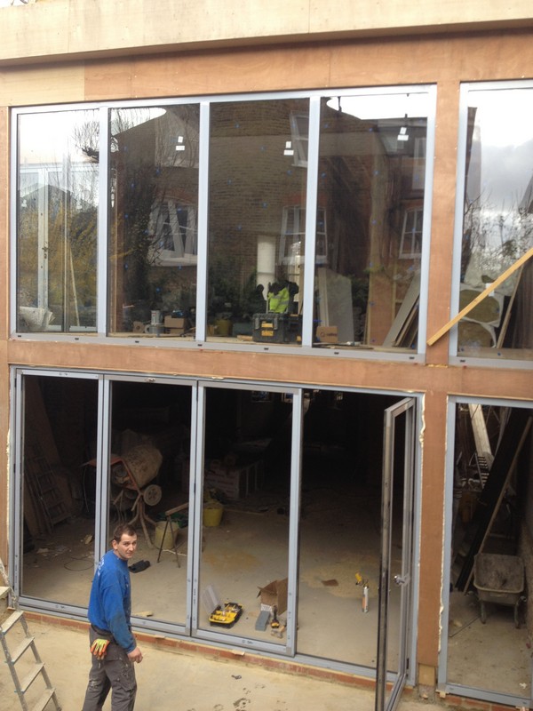 Aluminium bi-fold doors with two-storey glazing in Thame