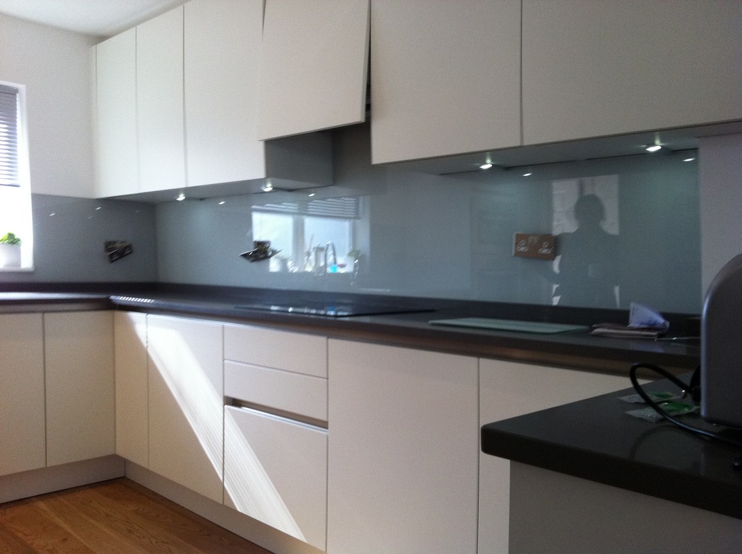 Grey glass kitchen splashback with LED lighting in Thame