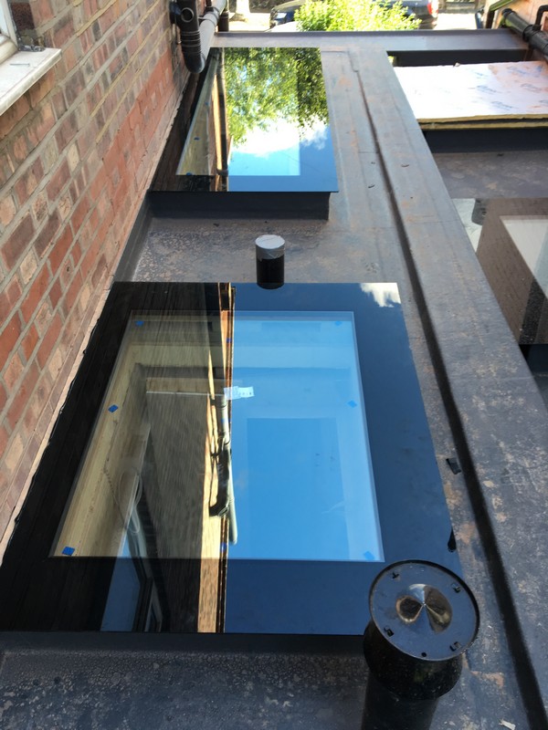 Multiple flat roof skylights on extension in Thame