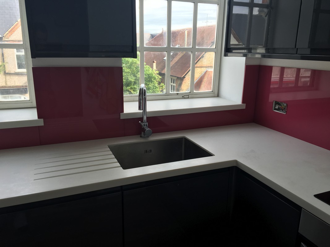 Deep plum coloured glass splashback in modern Thame kitchen